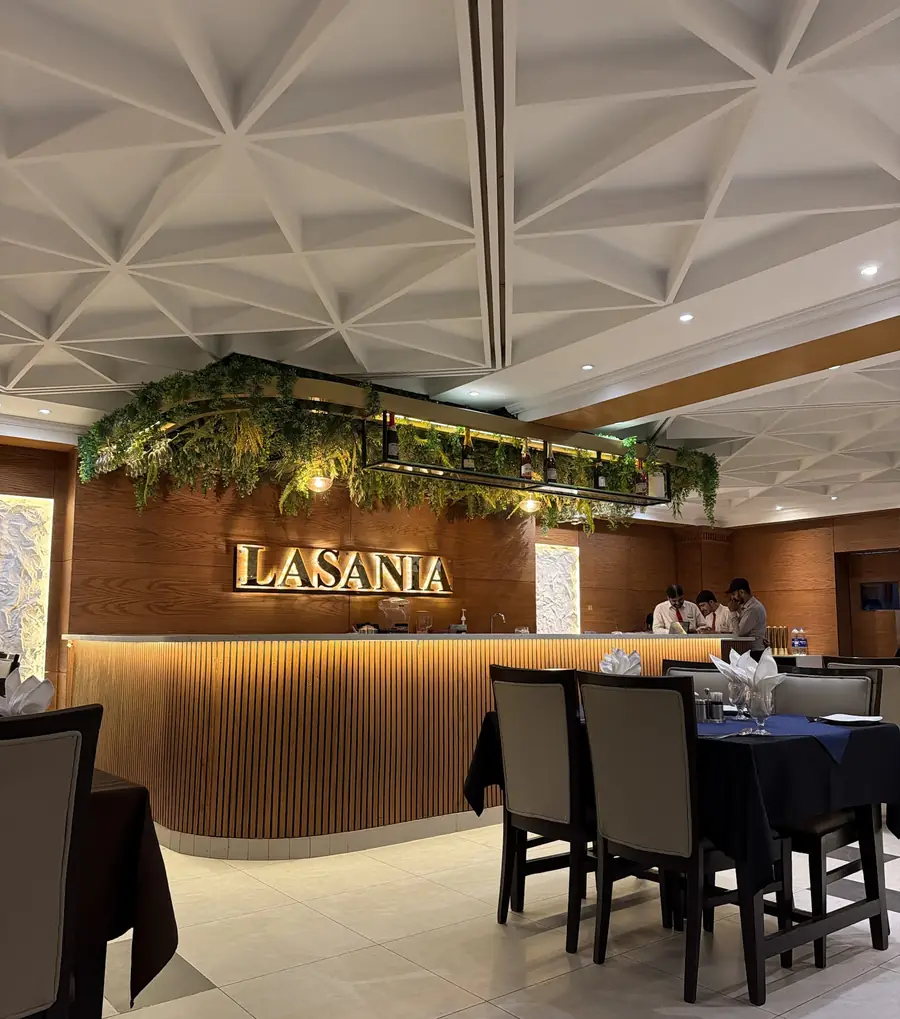 The front of the restaurant inside, with warm lighting