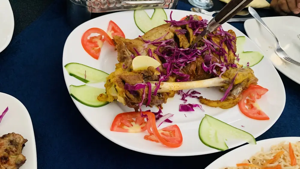 A plated roast with salad at Lasania